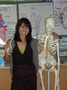 Alison Ball and her friendly classroom skeleton Photo: Oakland Voices/January 2013