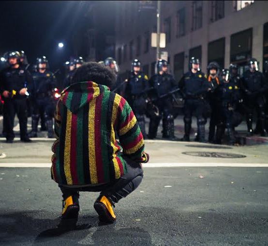 Oakland protester and police, November 9, 2016. Photo by: Cinque Mubarak