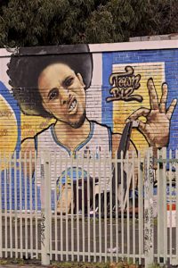 A mural of Steph Curry is one block away from Sean Moses' homeless camp in Oakland. 