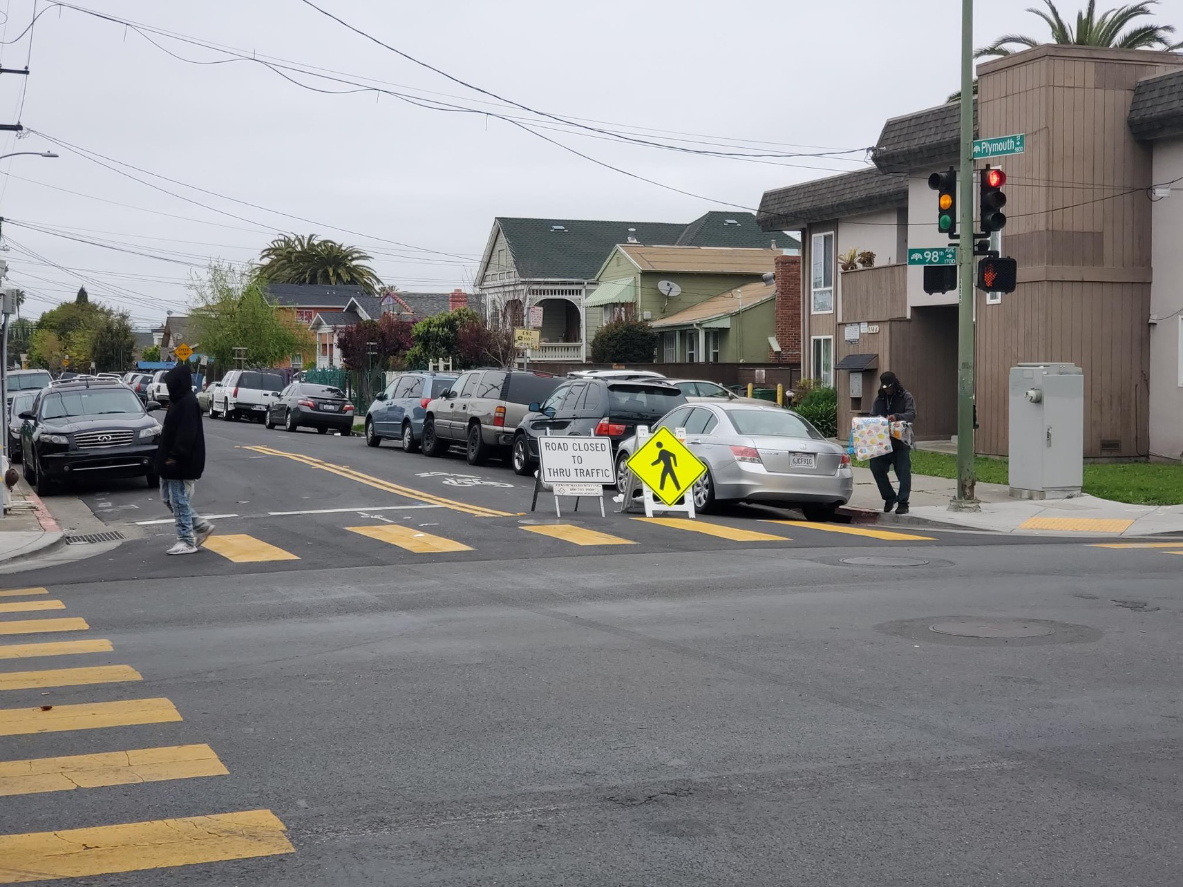 Oakland residents at intersection of 98th Ave and Plymouth Street.