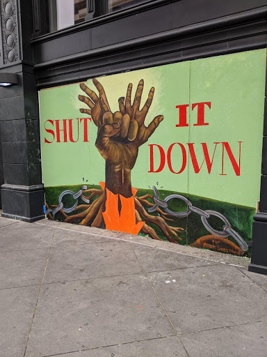 An image of two hands tied together with "shut it down" behind it.