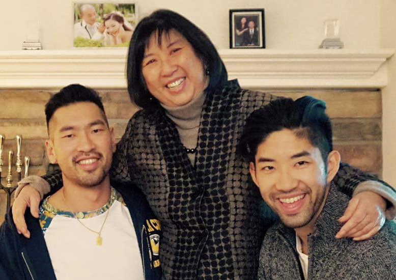 An Asian American mom is in the middle between her two grownup sons