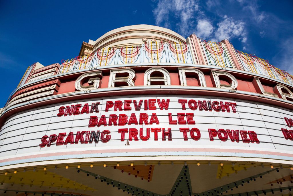 the Grand Lake Theatre marquee says "Sneak Preview Tonight Barbara Lee Speaking Truth to Power"