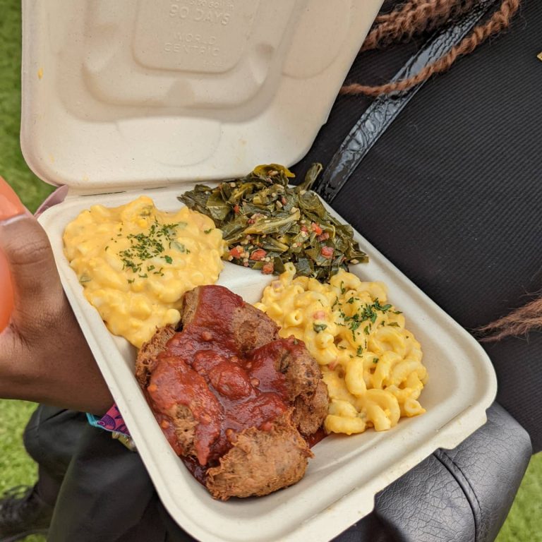 a plate of vegan soul food including Mac n cheese and greens