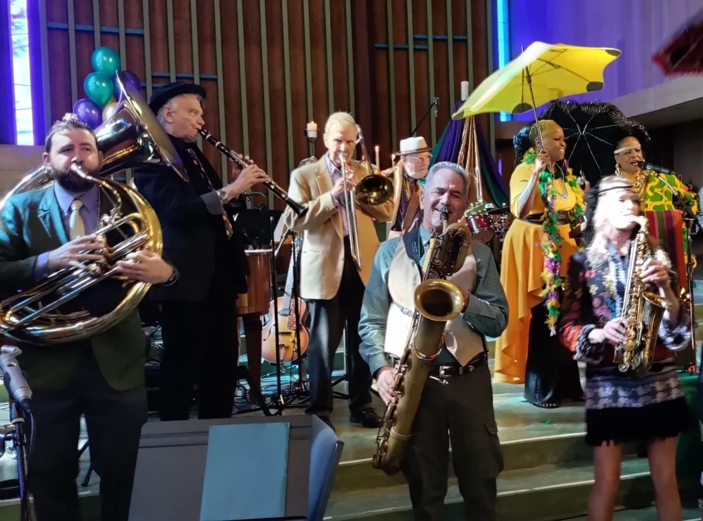 a lively jazz band plays inside a church 